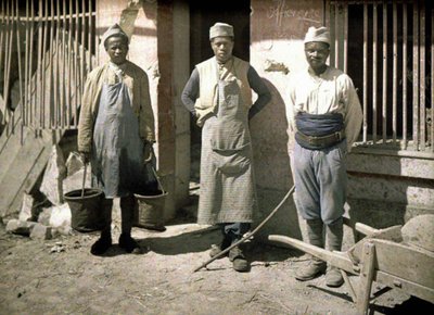 Three Workers from Senegal in Front of a House, Soissons, Aisne, France, 1917 by Fernand Cuville